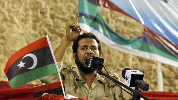 Libya former rebels' Tripoli military commander Abdel Hakim Belhaj delivers his speech during a gathering against ousted Moammar Gadhafi on the Green Square renamed Martyrs Square in Tripoli, Libya, Friday, Sept. 9, 2011. - Sputnik International