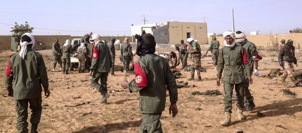 Soldiers attend to wounded and casualties in the aftermath of a suicide bomb attack who ripped through a camp grouping former rebels and pro-government militia in troubled northern Mali left 40 people dead on January 18, 2017 in Gao. Soldiers attend to wounded and casualties in the aftermath of a suicide bomb attack who ripped through a camp grouping former rebels and pro-government militia in troubled northern Mali left 40 people dead on January 18, 2017 in Gao. - Sputnik International