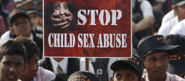Indian schoolchildren participate in an awareness campaign rally to mark World Day for the Prevention of Child Abuse and Violence against Children, in Hyderabad, India, Wednesday, Nov. 19, 2014 Indian schoolchildren participate in an awareness campaign rally to mark World Day for the Prevention of Child Abuse and Violence against Children, in Hyderabad, India, Wednesday, Nov. 19, 2014 - Sputnik International