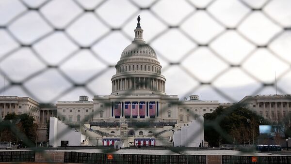 The U.S. Capitol building is seen behind a security fence in Washington, U.S., January 19, 2017 - Sputnik International