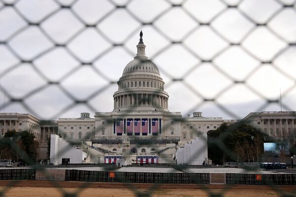 The U.S. Capitol building is seen behind a security fence in Washington ahead of the 2017 Presidential Inauguation. The U.S. Capitol building is seen behind a security fence in Washington ahead of the 2017 Presidential Inauguation. - Sputnik International