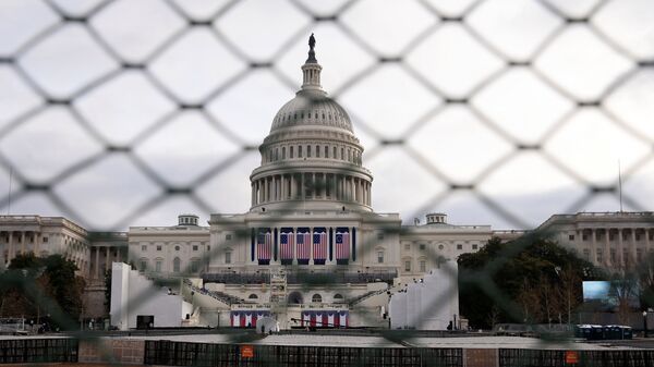 The U.S. Capitol building is seen behind a security fence in Washington ahead of the 2017 Presidential Inauguation. - Sputnik International
