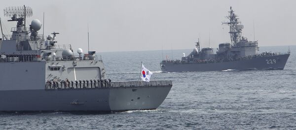 South Korea's Dea Joyeong vessel travels alongside the Japanese escort ship “Abukuma” during an event held ahead of Sunday's official triennial Maritime Self-Defense Force fleet review off Sagami Bay, south of Tokyo, Japan, Thursday, Oct. 15, 2015 South Korea's Dea Joyeong vessel travels alongside the Japanese escort ship “Abukuma” during an event held ahead of Sunday's official triennial Maritime Self-Defense Force fleet review off Sagami Bay, south of Tokyo, Japan, Thursday, Oct. 15, 2015 - Sputnik International