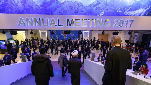 Participants to the World Economic Forum walk down the stairs in the Congress Centre, on the opening day of the World Economic Forum, on January 17, 2017 in Davos - Sputnik International