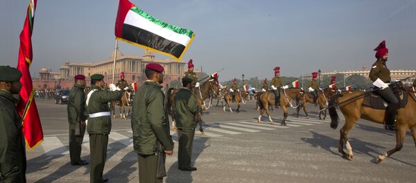 United Arab Emirates, UAE, armed forces soldiers, left, stand in attention as horse-mounted Indian presidential bodyguards march by during the rehearsals for the Republic Day parade at Rajpath in New Delhi, India, Friday, Jan. 20, 2017 - Sputnik International