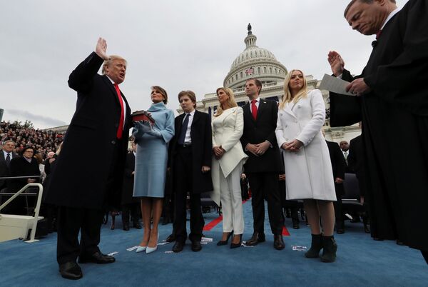 U.S. President Donald Trump takes the oath of office as his wife Melania holds the bible and his children Barron, Ivanka, Eric and Tiffany watch as U.S. Supreme Court Chief Justice John Roberts (R) administers the oath during inauguration ceremonies swearing in Trump as the 45th president of the United States on the West front of the U.S. Capitol in Washington, DC, U.S., January 20, 2017 U.S. President Donald Trump takes the oath of office as his wife Melania holds the bible and his children Barron, Ivanka, Eric and Tiffany watch as U.S. Supreme Court Chief Justice John Roberts (R) administers the oath during inauguration ceremonies swearing in Trump as the 45th president of the United States on the West front of the U.S. Capitol in Washington, DC, U.S., January 20, 2017 - Sputnik International