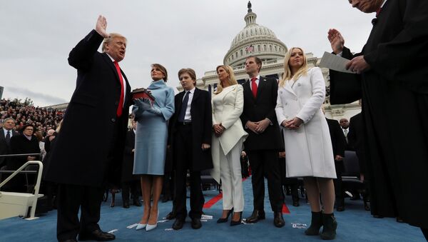 U.S. President Donald Trump takes the oath of office as his wife Melania holds the bible and his children Barron, Ivanka, Eric and Tiffany watch as U.S. Supreme Court Chief Justice John Roberts (R) administers the oath during inauguration ceremonies swearing in Trump as the 45th president of the United States on the West front of the U.S. Capitol in Washington, DC, U.S., January 20, 2017 - Sputnik International