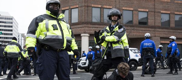 Police officers detain a demonstrator before the inauguration of President-elect Donald Trump January 20, 2017 in Washington, DC. Police officers detain a demonstrator before the inauguration of President-elect Donald Trump January 20, 2017 in Washington, DC. - Sputnik International