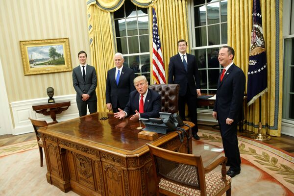 US President Donald Trump, flanked by Senior Advisor Jared Kushner (standing, L-R), Vice President Mike Pence, Staff Secretary Rob Porter and Chief of Staff Reince Priebus, welcomes reporters into the Oval Office for him to sign his first executive orders at the White House in Washington, US January 20, 2017. US President Donald Trump, flanked by Senior Advisor Jared Kushner (standing, L-R), Vice President Mike Pence, Staff Secretary Rob Porter and Chief of Staff Reince Priebus, welcomes reporters into the Oval Office for him to sign his first executive orders at the White House in Washington, US January 20, 2017. - Sputnik International