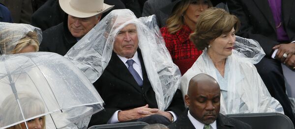 Former president George W. Bush keeps covered in the rain as he sits with his wife Laura at the inauguration ceremonies swearing in Donald Trump as the 45th president of the United States on the West front of the U.S. Capitol in Washington, U.S., January 20, 2017 Former president George W. Bush keeps covered in the rain as he sits with his wife Laura at the inauguration ceremonies swearing in Donald Trump as the 45th president of the United States on the West front of the U.S. Capitol in Washington, U.S., January 20, 2017 - Sputnik International