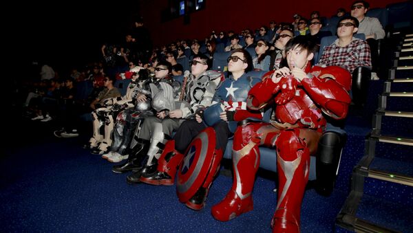 A group of fans dressed in homemade replica armour of Avengers: Age of Ultron movie characters, Iron Man, Captain America and Thor, watch the film in a theatre in Changchun, Jilin province, China on May 16, 2015 - Sputnik International