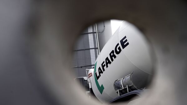 A picture shows the logo on a cement mixer of French cement company Lafarge at one of its plants on April 7, 2014 in Paris - Sputnik International
