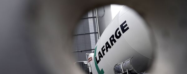 A picture shows the logo on a cement mixer of French cement company Lafarge at one of its plants on April 7, 2014 in Paris - Sputnik International