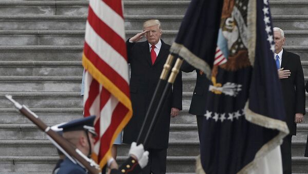 Newly inaugurated U.S. President Donald Trump salutes as he presides over a military parade during Trump's swearing ceremony in Washington, U.S., January 20, 2017 - Sputnik International