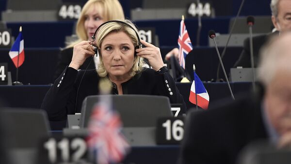 French Front National (National Front - FN) far-right party's President, European MP and candidate for the 2017 French Presidential elections Marine Le Pen adjusts her headphones as she attends a debate on the conclusions of the European Council meeting on October 20-21 at the European Parliament in Strasbourg, eastern France, on October 26, 2016 - Sputnik International