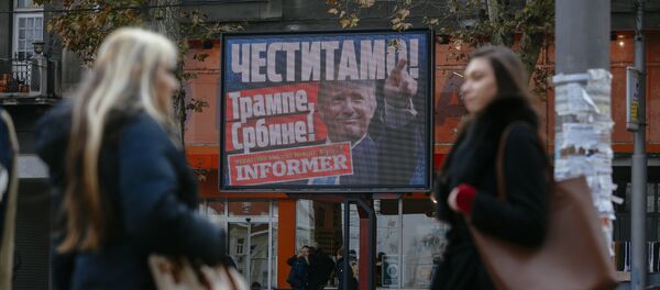 Pedestrians walk by a billboard picturing US President-elect Donald Trump with an inscrpition that translates as Congratulations! Trump, Serb! published by Serbian daily newspaper in Belgrade on November 10, 2016 Pedestrians walk by a billboard picturing US President-elect Donald Trump with an inscrpition that translates as Congratulations! Trump, Serb! published by Serbian daily newspaper in Belgrade on November 10, 2016 - Sputnik International