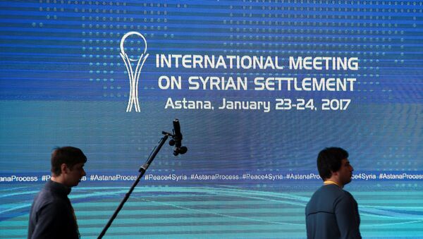 Reporters walk in the media center set for Syria peace talks, in Astana, Kazakhstan, January 23, 2017. - Sputnik International