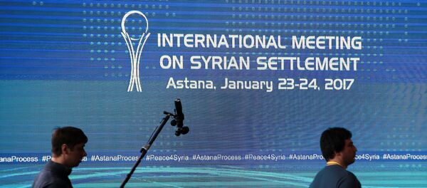 Reporters walk in the media center set for Syria peace talks, in Astana, Kazakhstan, January 23, 2017. Reporters walk in the media center set for Syria peace talks, in Astana, Kazakhstan, January 23, 2017. - Sputnik International