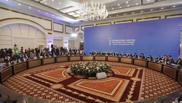 Delegations of Russia, Iran and Turkey hold talks on Syrian peace at a hotel in Astana, Kazakhstan, Monday, Jan. 23, 2017 - Sputnik International