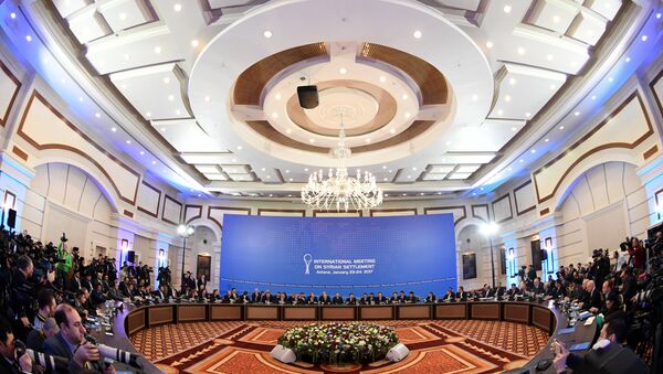 Representatives of the Syria regime and rebel groups along with other attendees take part in the first session of Syria peace talks at Astana's Rixos President Hotel - Sputnik International