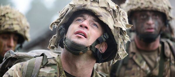 Royal British soldiers conduct the Urban Casualty Evacuation lane during the European Best Squad Competition at the 7th Army’s Joint Multinational Training Command’s, Grafenwoehr training area, Bavaria, Germany, Oct. 20, 2015. - Sputnik International