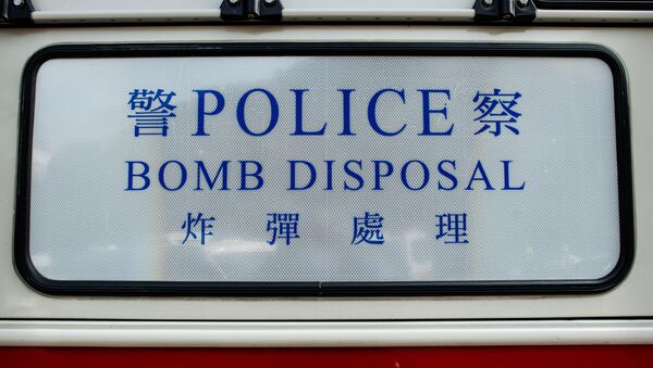 A marking of police bomb squad vehicle is seen in front of a closed road leading to a hiking trail after a World War II-era artillery shell was found by a hiker in Hong Kong (file) - Sputnik International