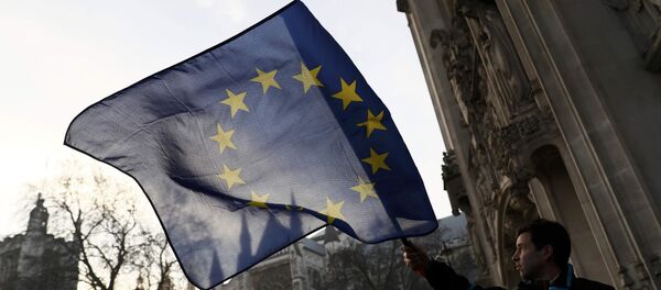 A man waves a European Union flag outside the Supreme Court before the decision of a court ruling on whether Theresa May's government requires parliamentary approval to start the process of leaving the European Union, in Parliament Square, central London, Britain, January 24, 2017. A man waves a European Union flag outside the Supreme Court before the decision of a court ruling on whether Theresa May's government requires parliamentary approval to start the process of leaving the European Union, in Parliament Square, central London, Britain, January 24, 2017. - Sputnik International