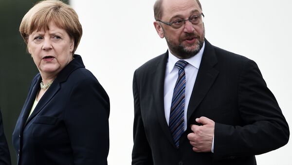 This file photo taken on May 29, 2016 shows German Chancellor Angela Merkel (L) and the President of the European Parliament Martin Schulz during a remembrance ceremony to mark the centenary of the battle of Verdun, at the Douaumont Ossuary (Ossuaire de Douaumont), northeastern France. - Sputnik International