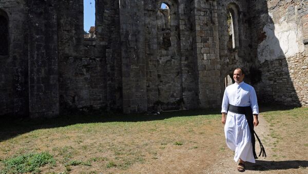 Father Guillaume Soury-Lavergne walks in the Benedictine abbey of Marcilhac-sur-Cele, in the Lot gorges, southern France. (File) - Sputnik International