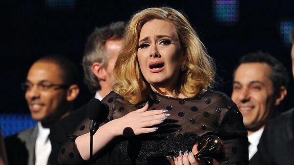 Singer Adele cries as she accepts her Grammy for Album of the Year at the Staples Center during the 54th Grammy Awards in Los Angeles, California, February 12, 2012. - Sputnik International