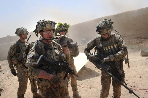 In this photo taken on August 5, 2011, US troops from the Charlie Company, 2-87 Infantry, 3d Brigade Combat Team under Afghanistan's International Security Assistance Force patrols Kandalay village following Taliban attacks on a joint US and Afghan National Army checkpoint protecting the western area of Kandalay village. In this photo taken on August 5, 2011, US troops from the Charlie Company, 2-87 Infantry, 3d Brigade Combat Team under Afghanistan's International Security Assistance Force patrols Kandalay village following Taliban attacks on a joint US and Afghan National Army checkpoint protecting the western area of Kandalay village. - Sputnik International