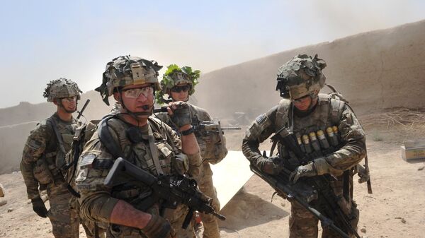 In this photo taken on 5 August 2011, US troops from the Charlie Company, 2-87 Infantry, 3d Brigade Combat Team under Afghanistan's International Security Assistance Force patrols Kandalay village following Taliban attacks on a joint US and Afghan National Army checkpoint protecting the western area of Kandalay village. - Sputnik International
