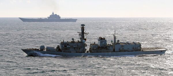HMS St Albans (front) monitors Russian warships Pyotr Velikiy and the Admiral Kuznetsov (rear) as they pass close to UK territorial waters HMS St Albans (front) monitors Russian warships Pyotr Velikiy and the Admiral Kuznetsov (rear) as they pass close to UK territorial waters - Sputnik International