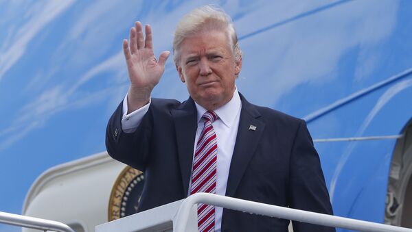 President Donald Trump waves as he arrives on Air Force One at Philadelphia International Airport - Sputnik International