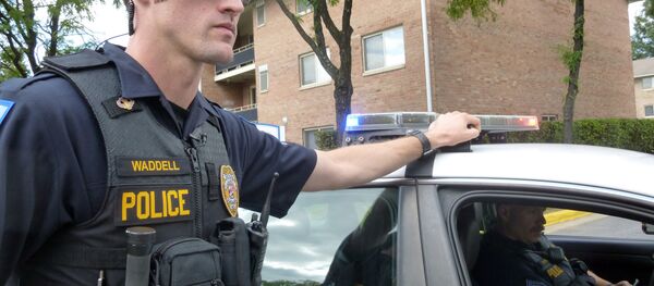Laurel, Maryland, Police Officer Aaron Waddell shows on September 17, 2014, how the Laurel Police Department has been using body-cameras during patrols. - Sputnik International