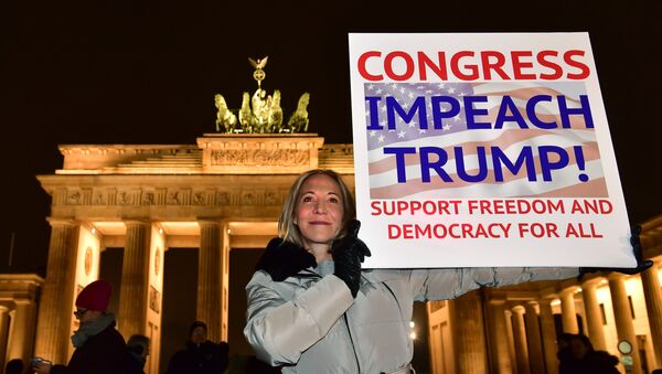 A protester shows a banner during an anti Donald Trump rally, on the day of his inauguration as US President, in front of Brandenburg Gate on January 20, 2017 in Berlin - Sputnik International