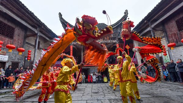 Locals perform a dragon dance during a celebration event ahead of China's Spring Festival, in Chenzhou, Hunan province, China, January 21, 2017. Picture taken January 21, 2017 - Sputnik International