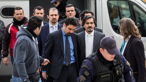 The eight Turkish soldiers, who fled to Greece in a helicopter and requested political asylum after a failed military coup against the government, are escorted by police officers as they arrive at the Supreme Court in Athens, Greece, January 26, 2017 - Sputnik International