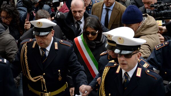 Mayor of Rome Virginia Raggi (C) leaves the city hall on the Campidoglio Square (Piazza Campidoglio) in central Rome on December 20, 2016 - Sputnik International