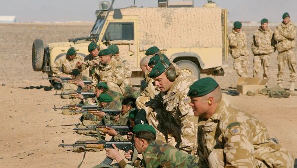 British Army officers from Operational Mentoring Liaison Training (OMLT) company train Afghan National Army or ANA, soldiers in firearms, near Camp Bastion, southern Afghanistan, Tuesday, Jan. 16, 2007. - Sputnik International