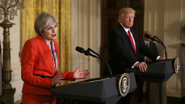 British Prime Minister Theresa May speaks as U.S. President Donald Trump listens during their joint news conference at the White House in Washington, U.S., January 27, 2017 - Sputnik International