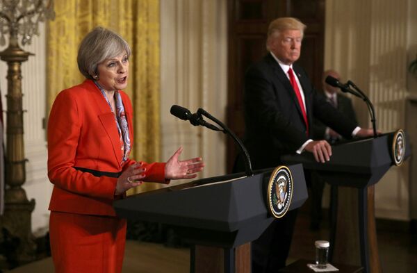 British Prime Minister Theresa May speaks as US President Donald Trump listens during their joint news conference at the White House in Washington, US, January 27, 2017 British Prime Minister Theresa May speaks as US President Donald Trump listens during their joint news conference at the White House in Washington, US, January 27, 2017 - Sputnik International