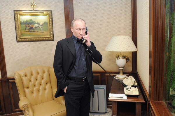 Vladimir Putin speaks by phone (File) Vladimir Putin speaks by phone (File) - Sputnik International