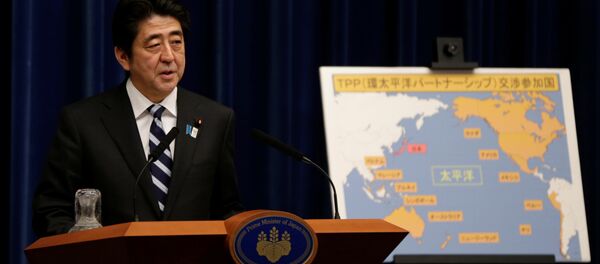 Japan's Prime Minister Shinzo Abe speaks next to a map showing participating countries in rule-making negotiations for the Trans-Pacific Partnership (TPP) during a news conference at his official residence in Tokyo (File) Japan's Prime Minister Shinzo Abe speaks next to a map showing participating countries in rule-making negotiations for the Trans-Pacific Partnership (TPP) during a news conference at his official residence in Tokyo (File) - Sputnik International