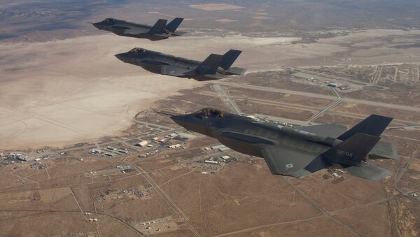 Three F-35 Joint Strike Fighters, (rear to front) AF-2, AF-3 and AF-4, flies over Edwards Air Force Base in this December 10, 2011 handout photo provided by Lockheed Martin - Sputnik International