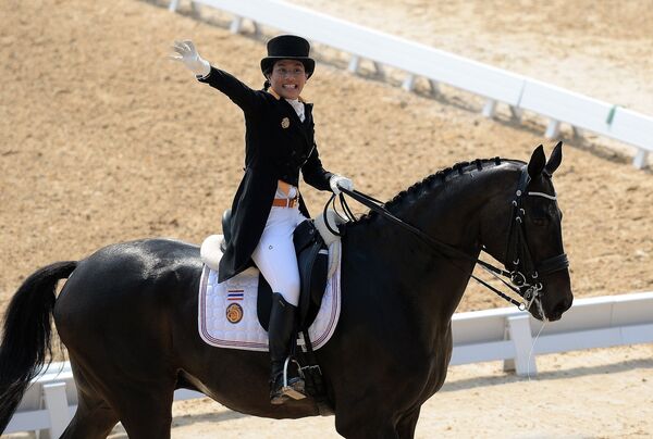 Thailand's Princess Sirivannavari Nariratana on Prince Charming WPA gestures during the equestrian dressage team competition at Dream Park during the 2014 Asian Games in Incheon on September 20, 2014 - Sputnik International
