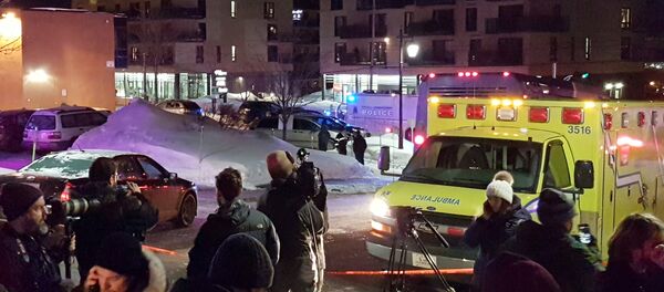An ambulance is parked at the scene of a fatal shooting at the Quebec Islamic Cultural Centre in Quebec City, Canada January 29, 2017 An ambulance is parked at the scene of a fatal shooting at the Quebec Islamic Cultural Centre in Quebec City, Canada January 29, 2017 - Sputnik International