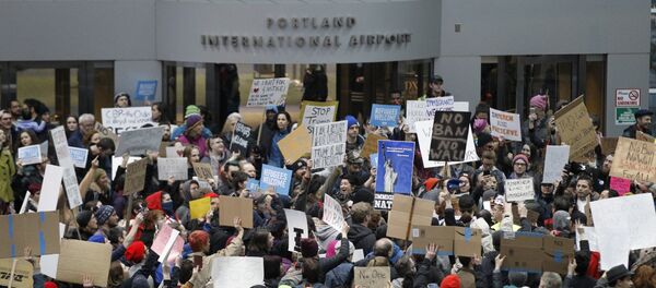 Activists gather at Portland International Airport to protest against President Donald Trump's executive action travel ban in Portland, Oregon, U.S. January 29, 2017 Activists gather at Portland International Airport to protest against President Donald Trump's executive action travel ban in Portland, Oregon, U.S. January 29, 2017 - Sputnik International