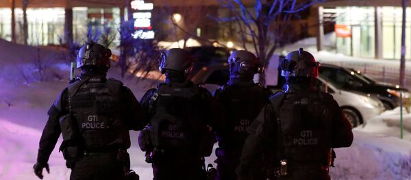 Swat team police officer walk aournd a mosque after a shooting in Quebec City, January 29, 2017 Swat team police officer walk aournd a mosque after a shooting in Quebec City, January 29, 2017 - Sputnik International