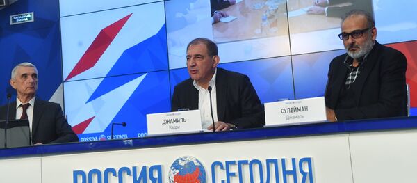 Qadri Jamil, center, chairman of the Syrian opposition's Moscow group, secretary of the People's Will Party and one of the leaders of the Popular Front for Change and Liberation, with Jamal Suleiman, right, a representative of the Syrian opposition's Cairo group, during a news conference at the Rossiya Segodnya International Multimedia Press Center in Moscow Qadri Jamil, center, chairman of the Syrian opposition's Moscow group, secretary of the People's Will Party and one of the leaders of the Popular Front for Change and Liberation, with Jamal Suleiman, right, a representative of the Syrian opposition's Cairo group, during a news conference at the Rossiya Segodnya International Multimedia Press Center in Moscow - Sputnik International